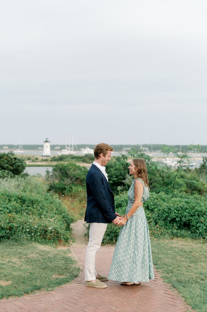 Couple walking along Lighthouse Beach during their Edgartown engagement session