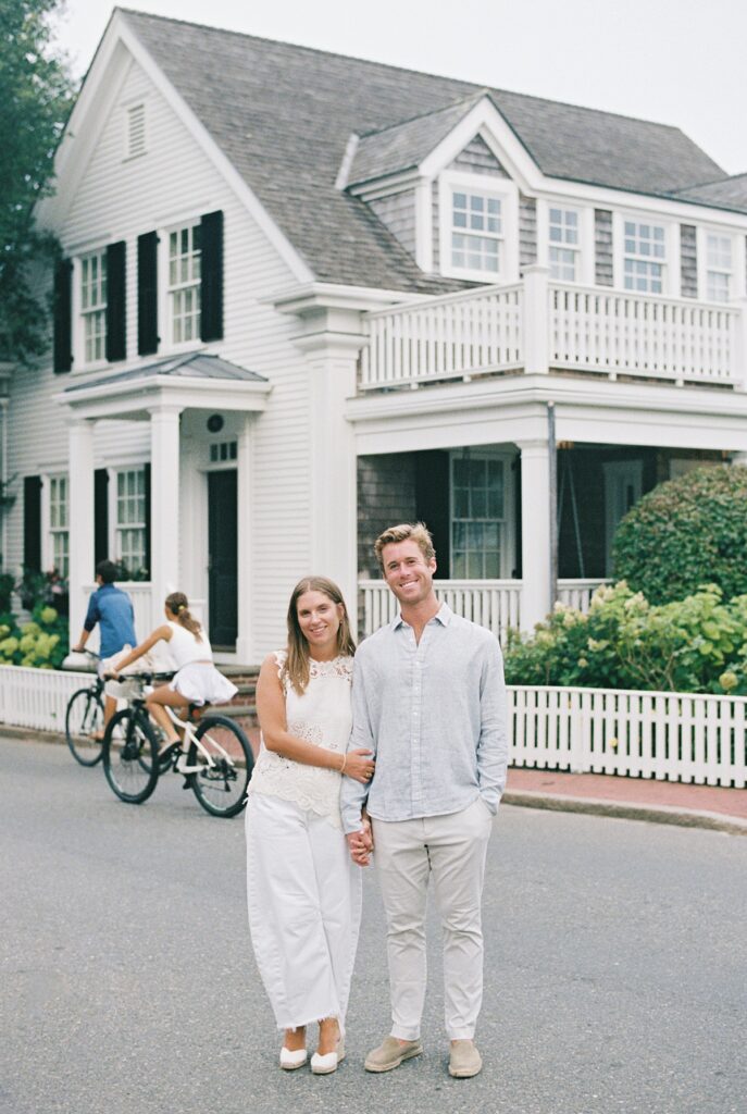 Engaged couple on North Water Street with historic homes in Edgartown