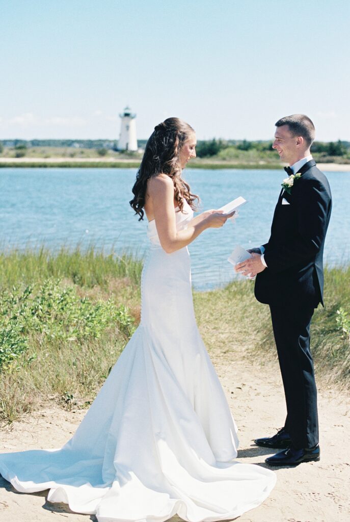 Bride and groom near the Edgartown Lighthouse following their Daniel Fisher House wedding