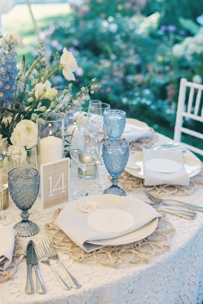 Reception tables beneath a sailcloth tent at the Daniel Fisher House.